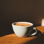 “잘 자야 하루가 산다”…수면에도 최신 건강 트렌드 바람 white ceramic cup on brown wooden table