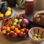 “여성 건강, 작은 습관에서 시작된다”…일상 속 변화로 지키는 건강 관리법 Fresh produce including tomatoes, carrots, and avocados on a counter.